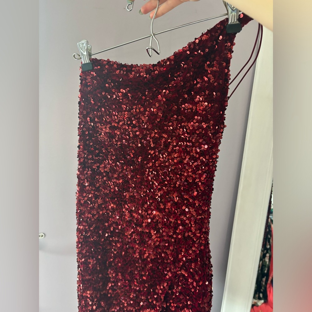 Short red sequence dress.